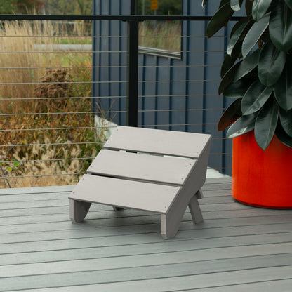 Light gray Granite Hills folding ottoman on a deck
