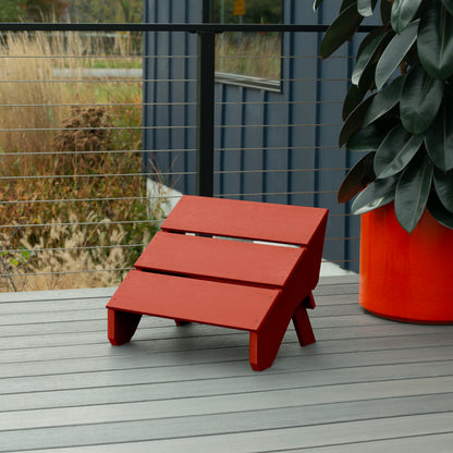 Red Granite Hills folding ottoman on a deck