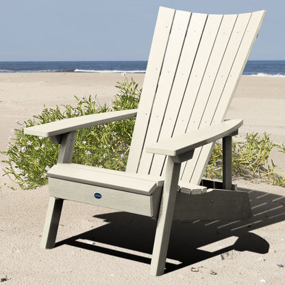 Whitewash Granite Hills folding and reclining Adirondack chair on a beach