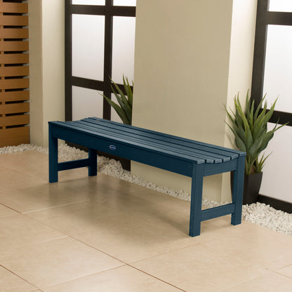 5ft Dark blue Blue Ridge backless bench in stone porch area