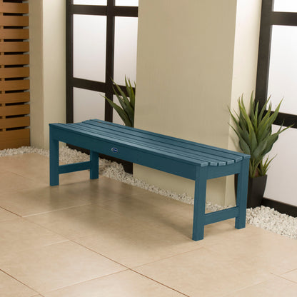 5ft light blue Blue Ridge backless bench in stone porch area