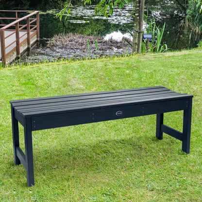 4ft dark blue Blue Ridge backless bench on grassy lawn