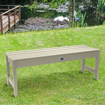 4ft Whitewash Blue Ridge backless bench on grassy lawn