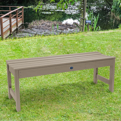 4ft light brown Blue Ridge backless bench on grassy lawn