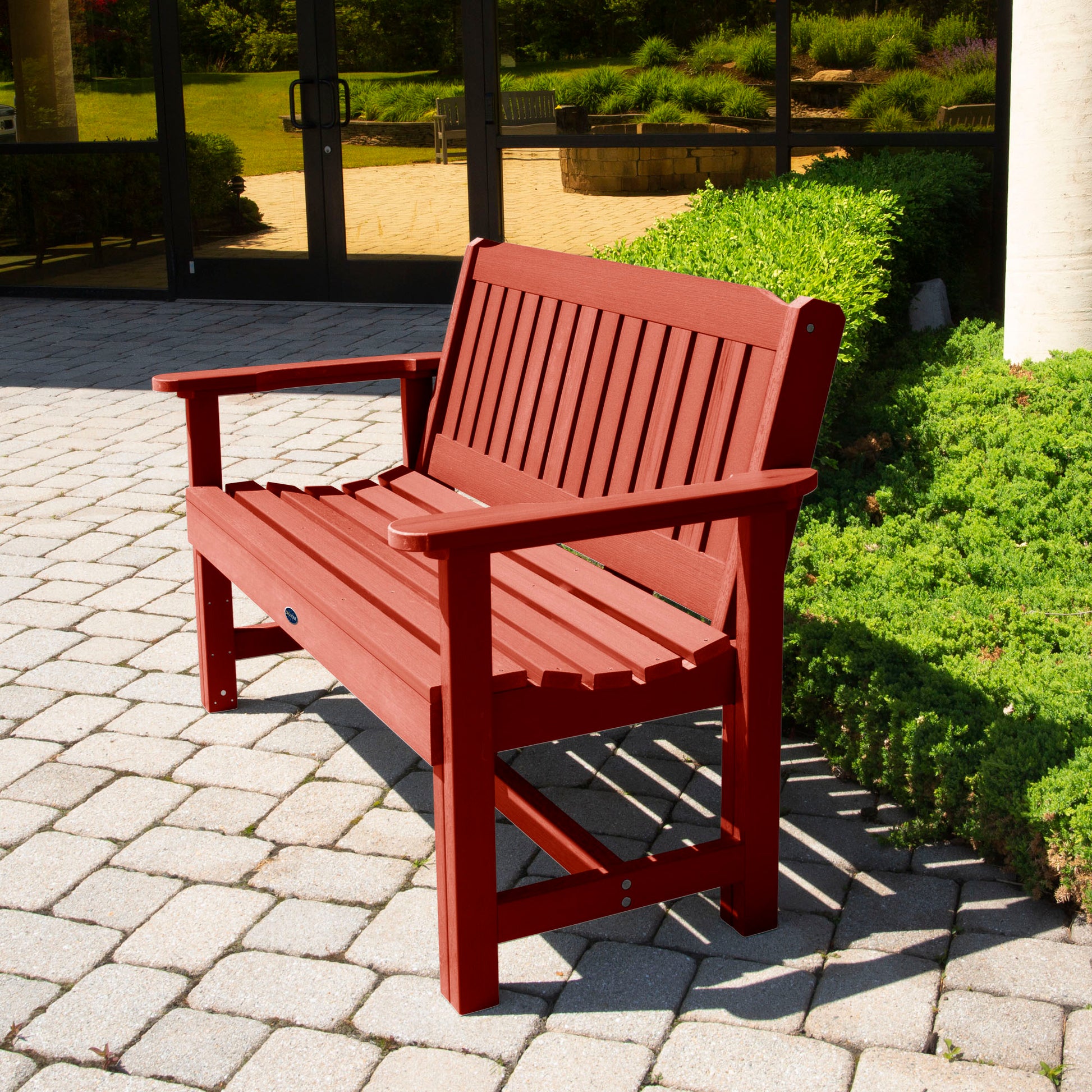 Red 4ft Blue Ridge Commercial Garden Bench on stone pathway