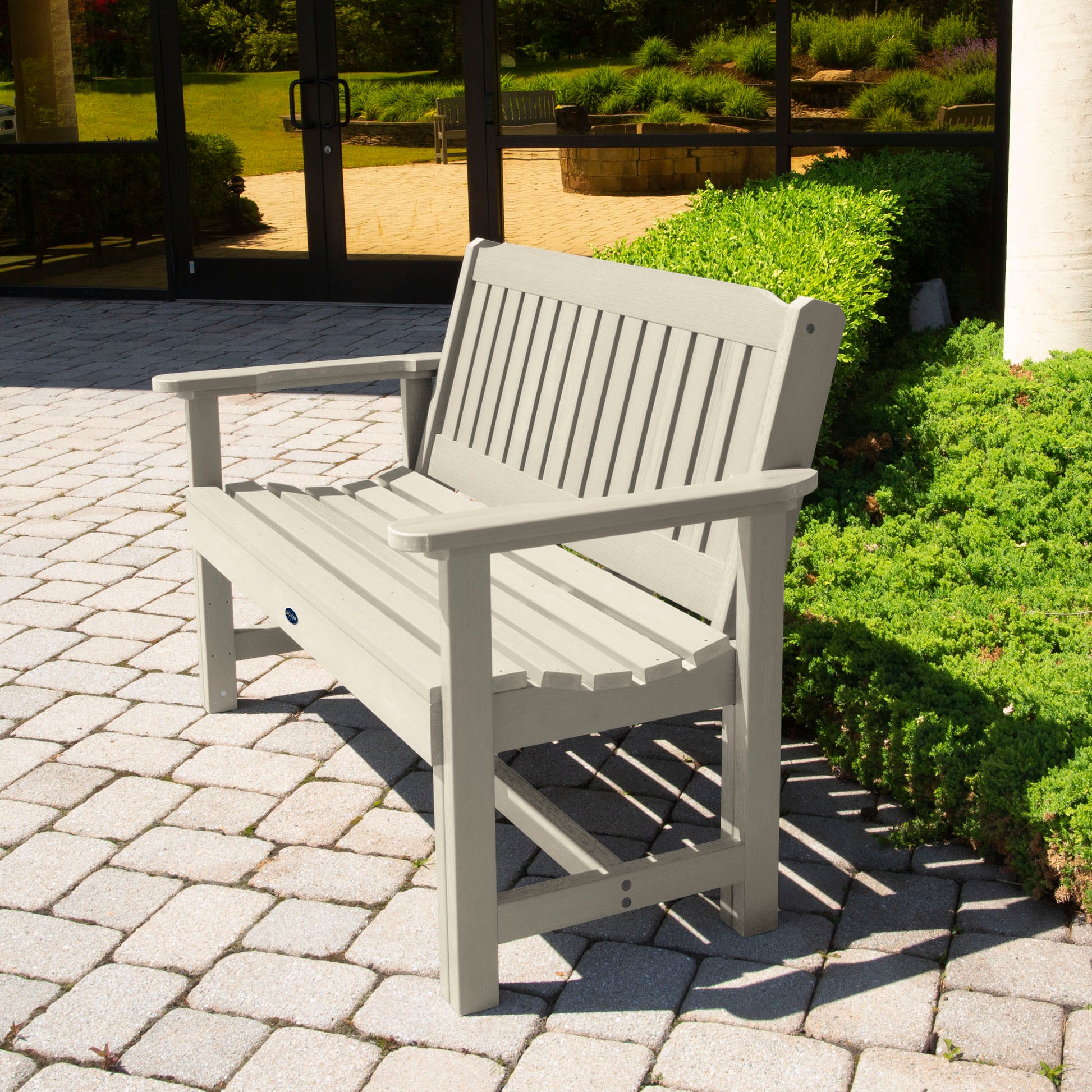 Whitewash 4ft Blue Ridge Commercial Garden Bench on stone pathway