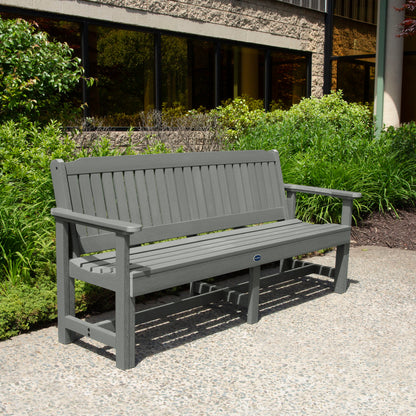 Gray 6ft Blue Ridge Garden Bench with bushes in background