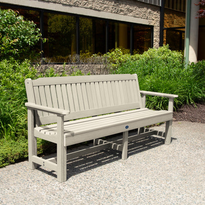 Whitewash 6ft Blue Ridge Garden Bench with bushes in background