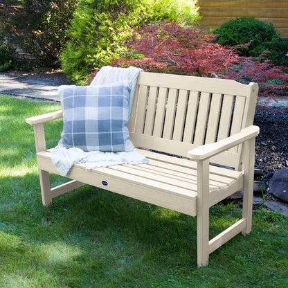 4ft Whitewash Blue Ridge garden bench on grass with blanket  and pillow