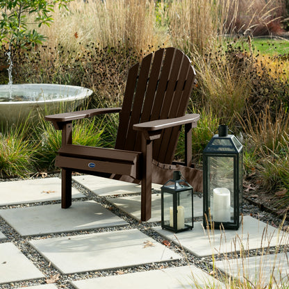 Brown Horizon Adirondack chair on stone next to lanterns