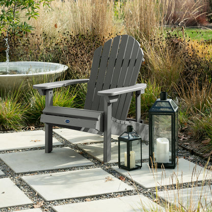 Gray Horizon Adirondack chair on stone next to lanterns
