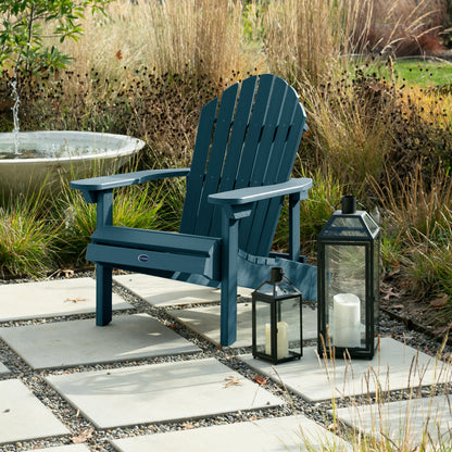Light blue Horizon Adirondack chair on stone next to lanterns
