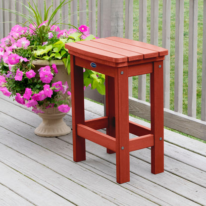 Red Blue Ridge counter height stool on tan wooden deck next to flowers
