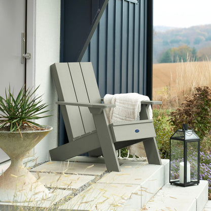 Light green Granite Hills Modern Adirondack chair on porch with blanket and pillow