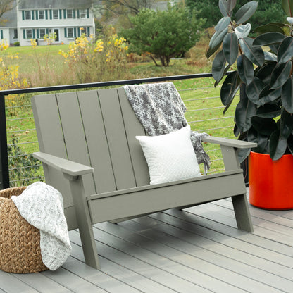 Light green Granite Hills double wide Adirondack chair with blankets and pillow