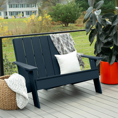 Dark blue Granite Hills double wide Adirondack chair with blankets and pillow