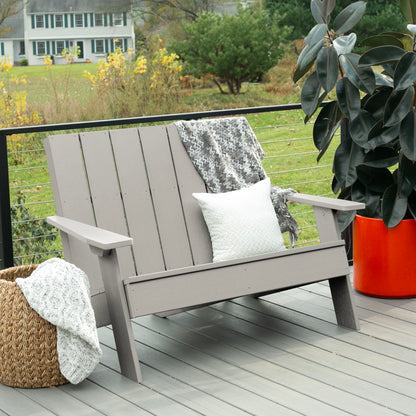 Light gray Granite Hills double wide Adirondack chair with blankets and pillow