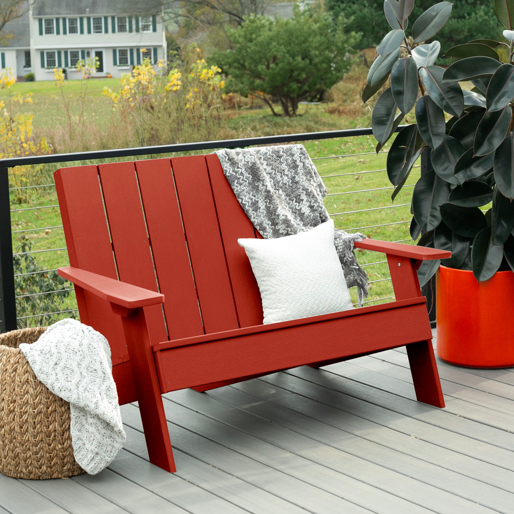 Red Granite Hills double wide Adirondack chair with blankets and pillow