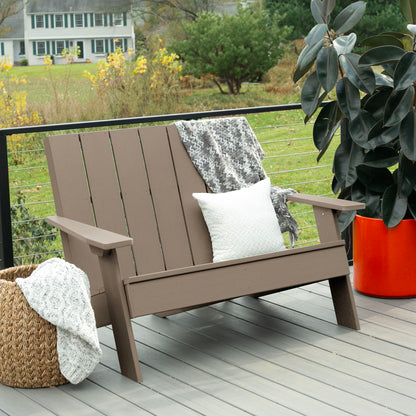 Light brown Granite Hills double wide Adirondack chair with blankets and pillow