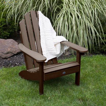 Brown Lighthouse Classic Adirondack Chair with blanket on grass