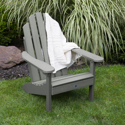 Gray Lighthouse Classic Adirondack Chair with blanket on grass