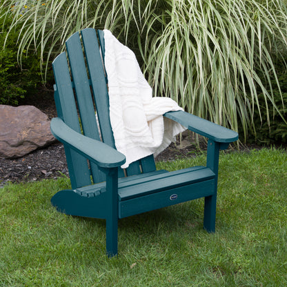 Light blue Lighthouse Classic Adirondack Chair with blanket on grass