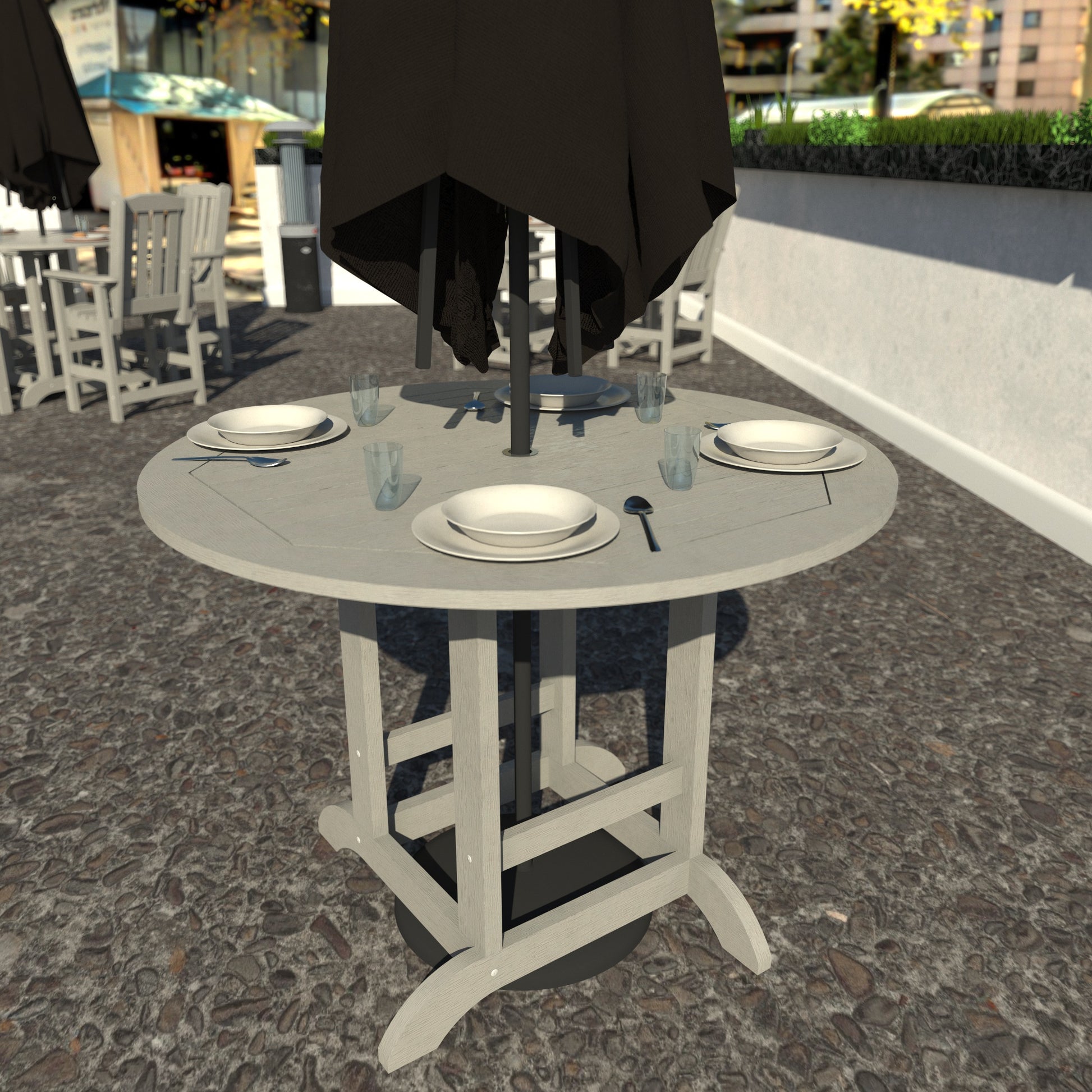 Light gray 48in diameter dining height table with plates set