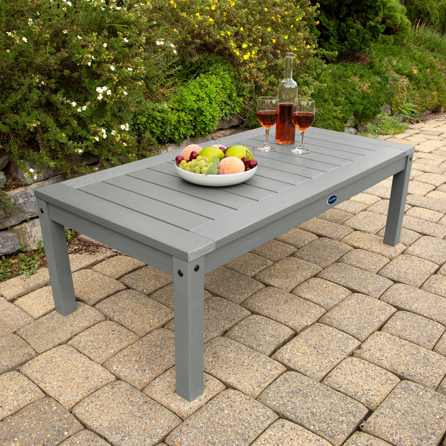 Gray Adirondack Conversation table with wine and fruit bowl 