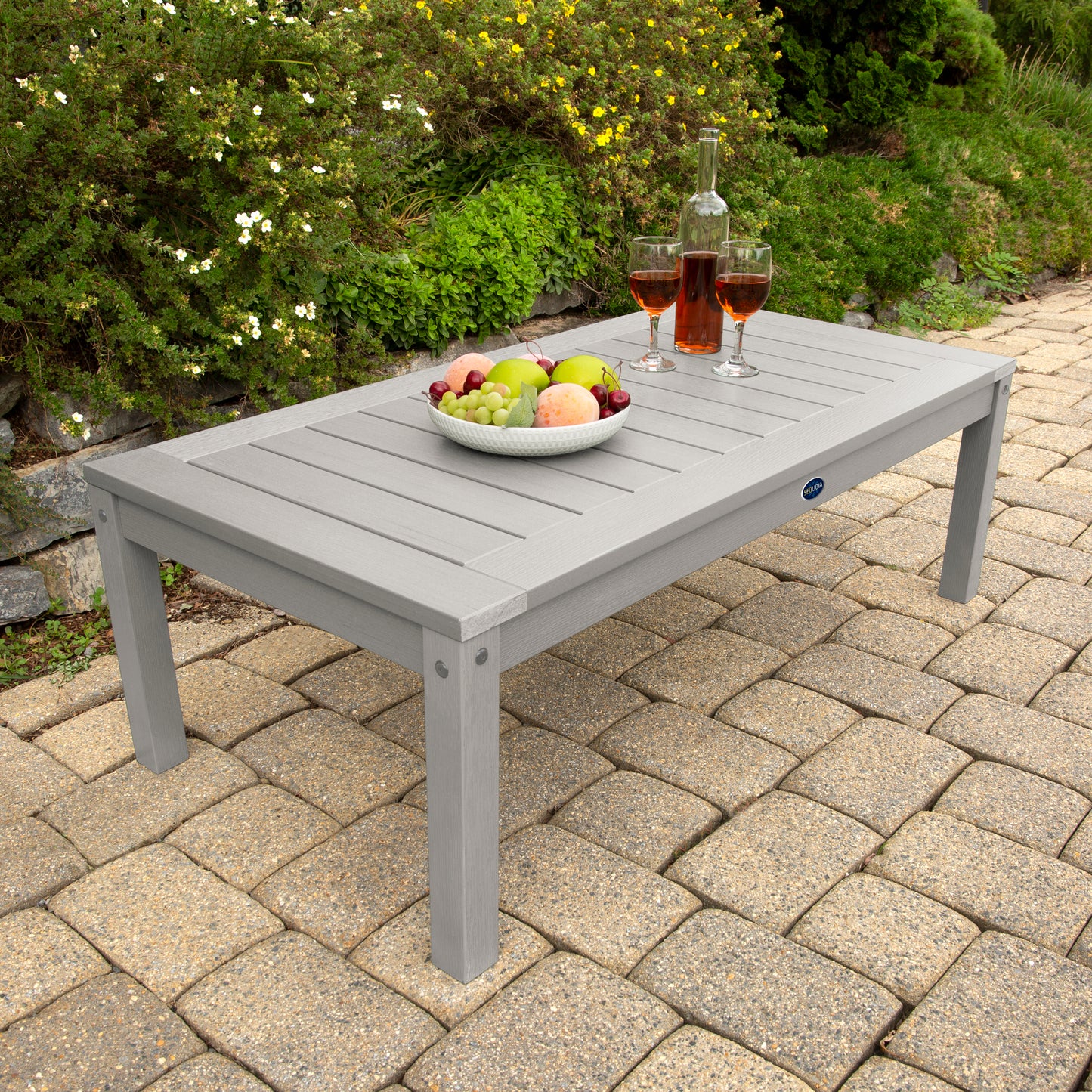 Light gray Adirondack Conversation table with wine and fruit bowl 