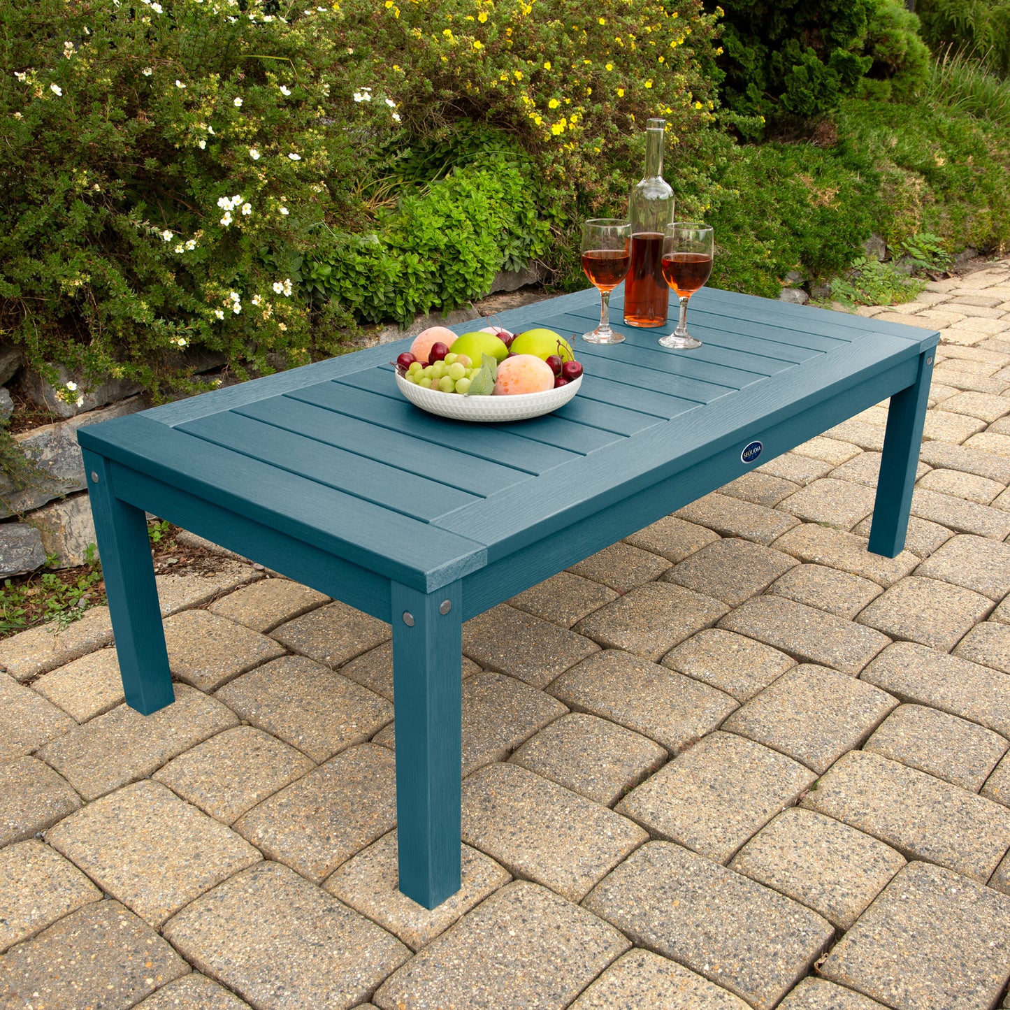 Light blue Adirondack Conversation table with wine and fruit bowl 