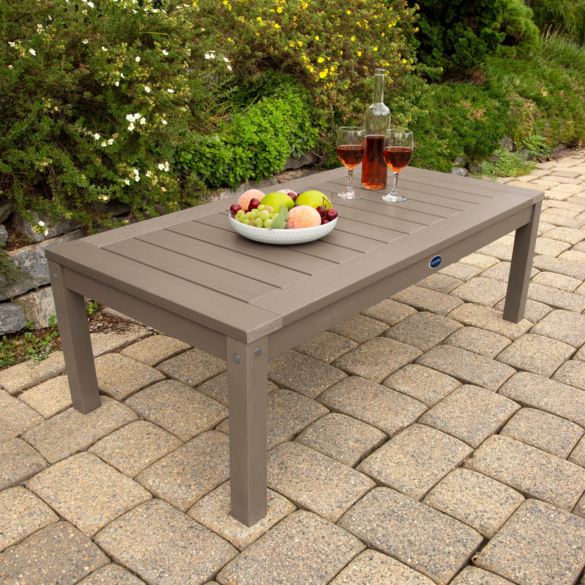 Light brown Adirondack Conversation table with wine and fruit bowl 