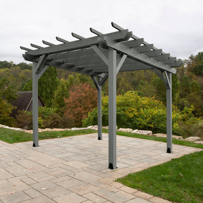Teak St. Clair 12 x 12 Pergola on stone patio with trees in background