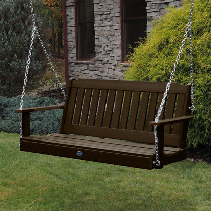 Brown 5ft Blue Ridge porch swing with stone house in background