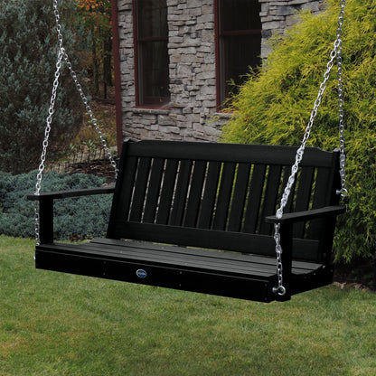 Black 5ft Blue Ridge porch swing with stone house in background