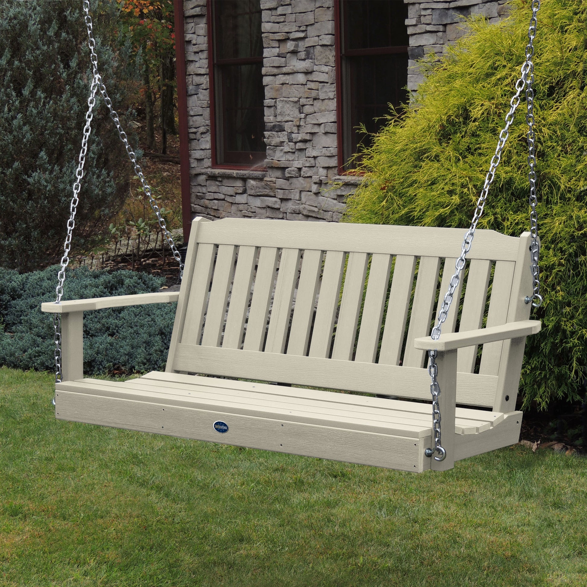 Whitewash 5ft Blue Ridge porch swing with stone house in background