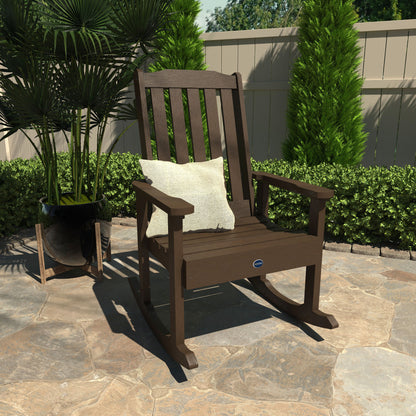 Brown Blue Ridge rocking chair on stone patio with pillow