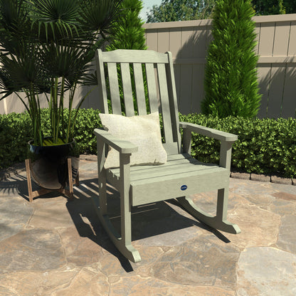 Light green Blue Ridge rocking chair on stone patio with pillow