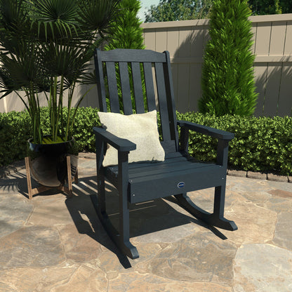Dark blue Blue Ridge rocking chair on stone patio with pillow