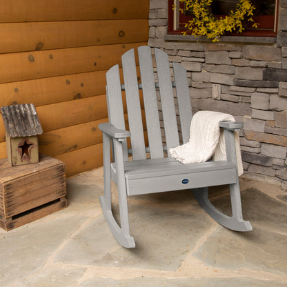 Light gray Lighthouse Garden Rocking Chair on porch with blanket