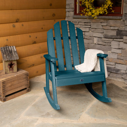 Light blue Lighthouse Garden Rocking Chair on porch with blanket