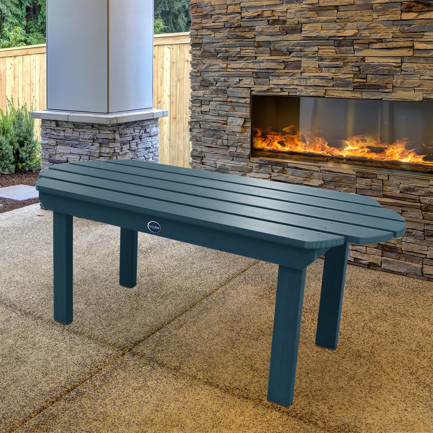 Light blue Lighthouse conversation table in front of outdoor fireplace 