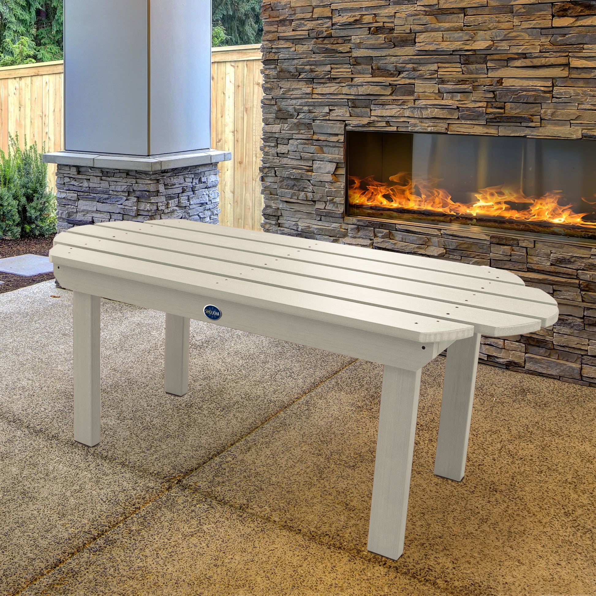 Whitewash Lighthouse conversation table in front of outdoor fireplace 