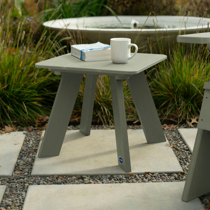 Light green Granite Hills side table with book and coffee mug
