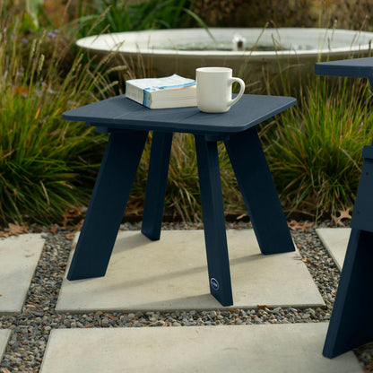 Dark blue Granite Hills side table with book and coffee mug