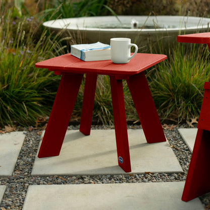 Red Granite Hills side table with book and coffee mug