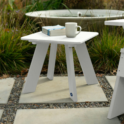 White Granite Hills side table with book and coffee mug