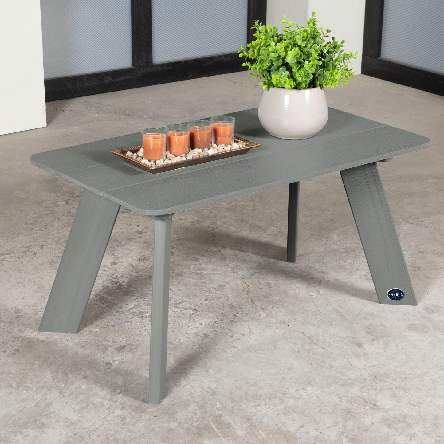 Gray Granite Hills coffee table with candles and plant