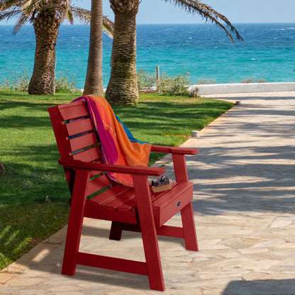 Red Sunrise Coast garden chair on walkway near water