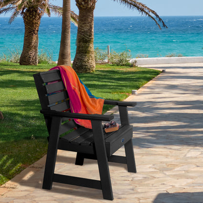 Black Sunrise Coast garden chair on walkway near water