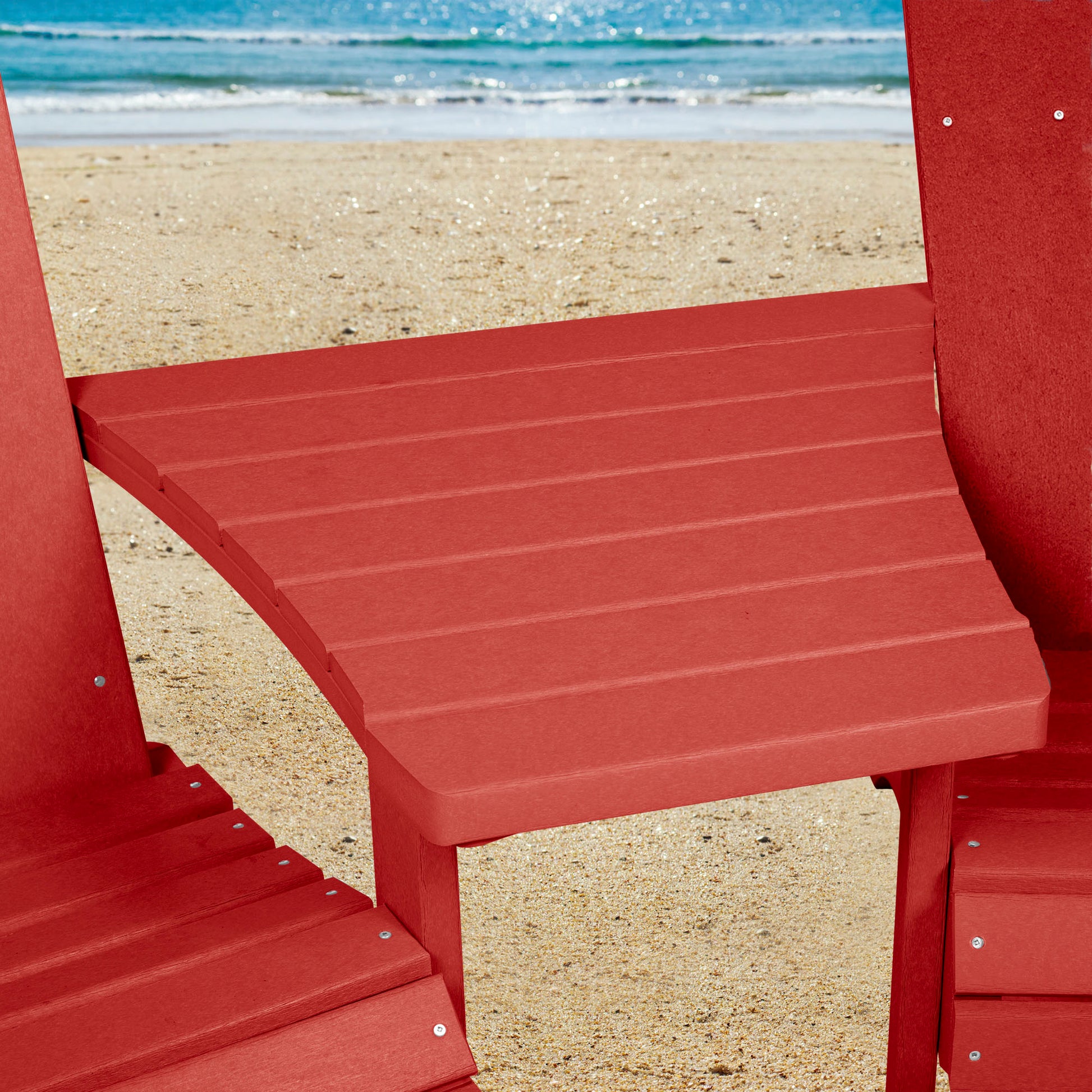 Red Sunrise Coast comfort height chairs and connecting table on beach